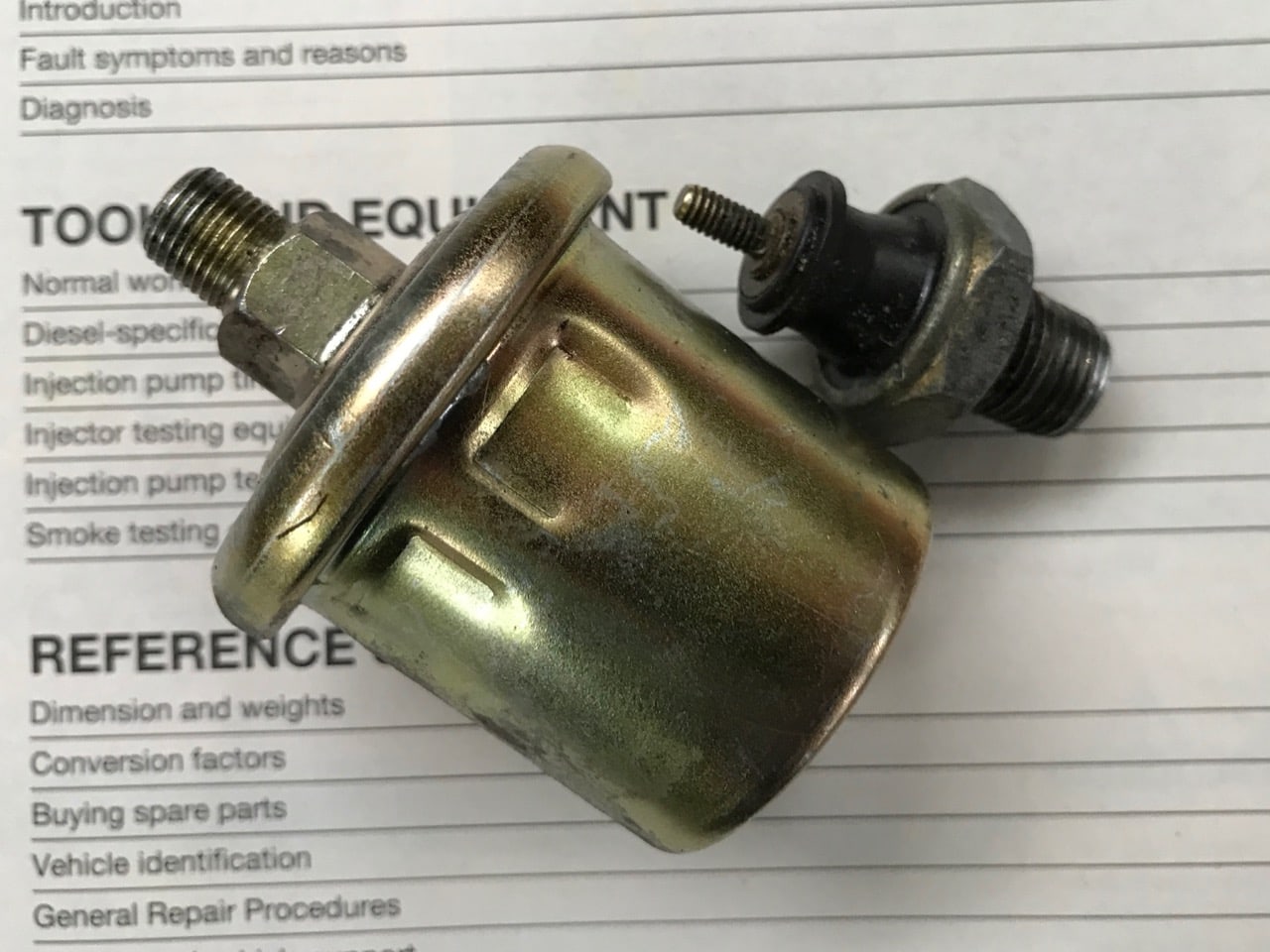 2 Oil Pressure senders removed from the engine.