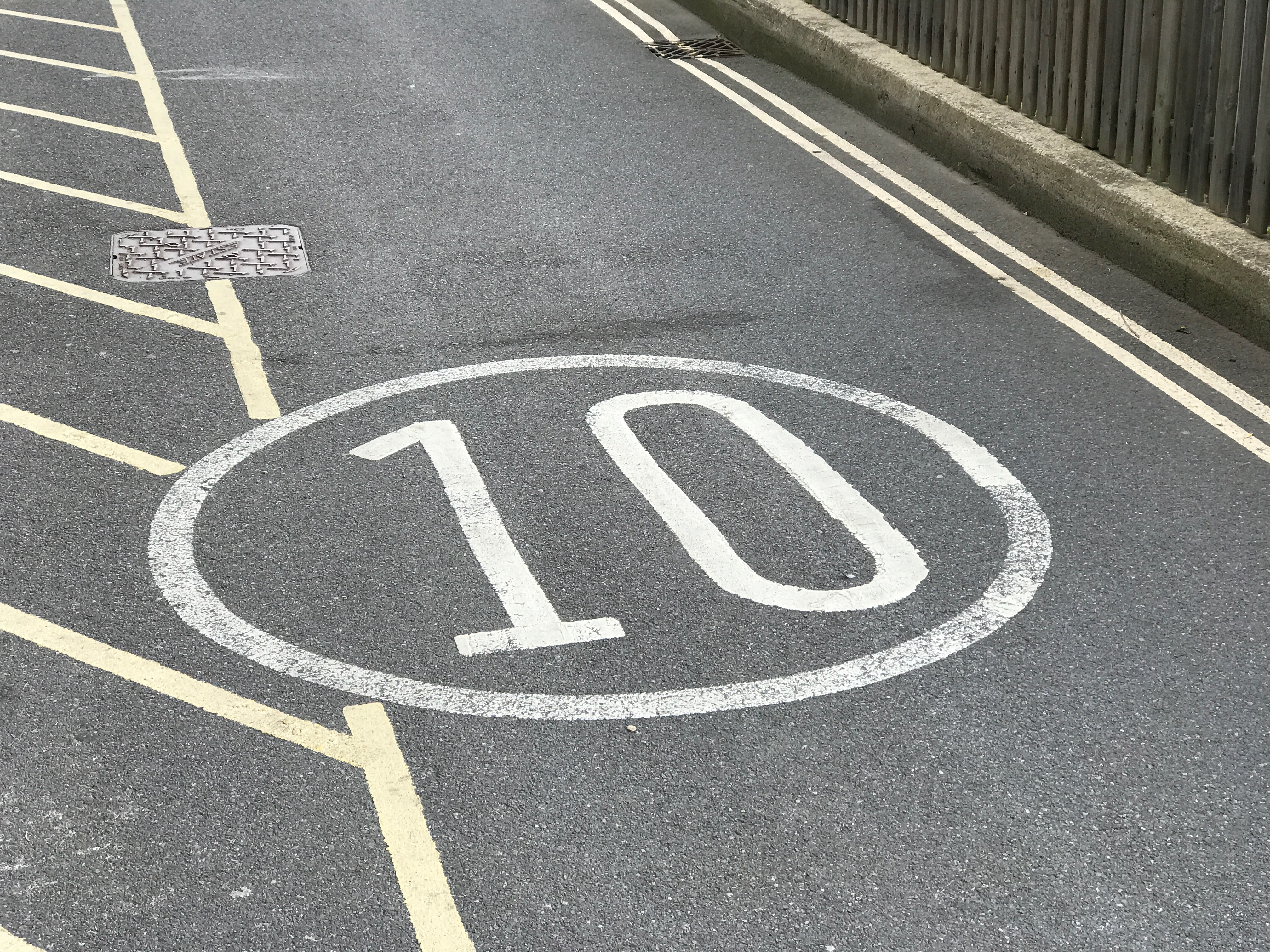 The number 10 on the road with a slab serif font