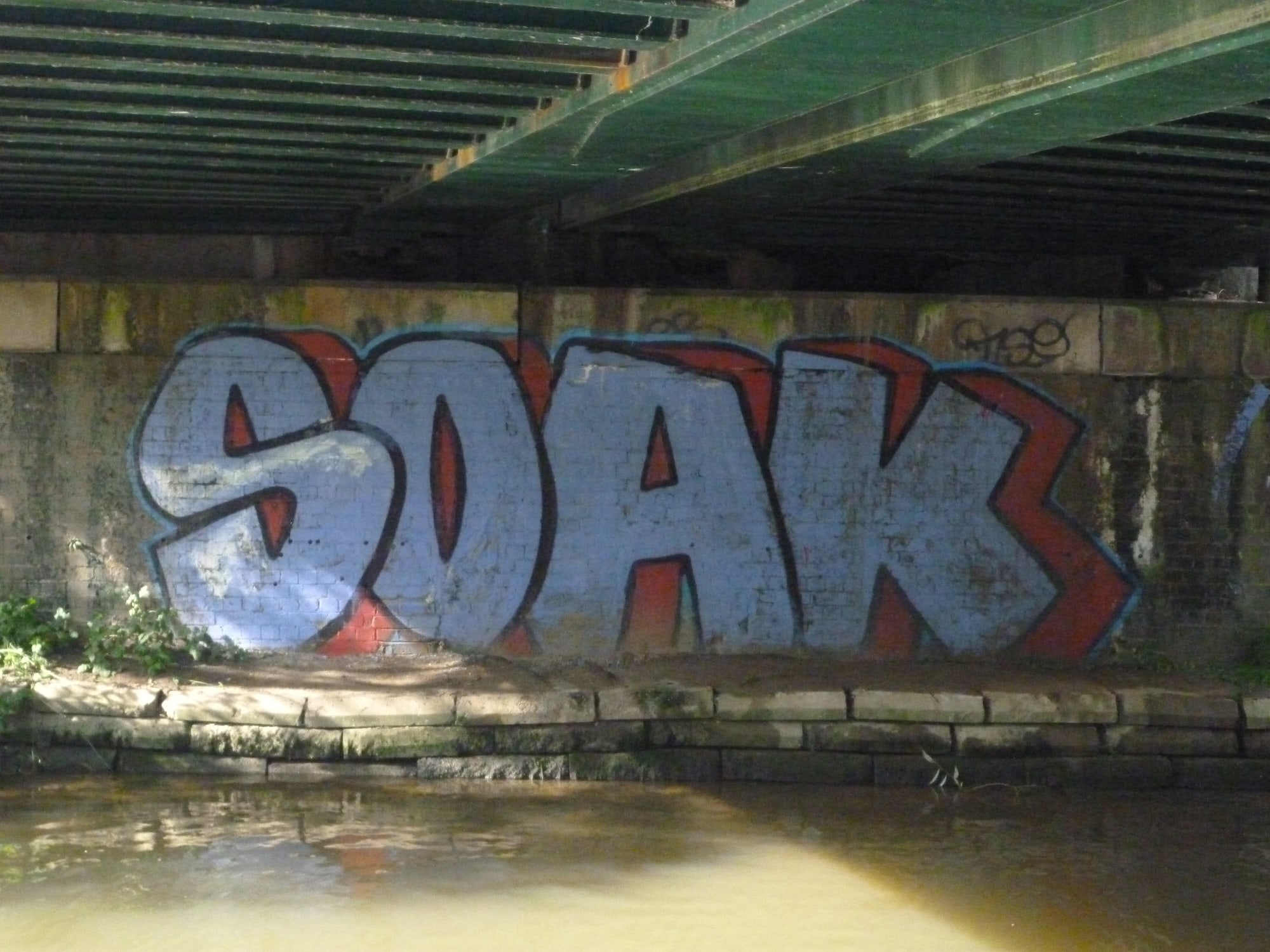 Graffiti on bridge. Overlapping letters